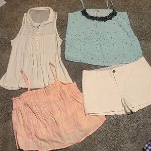 Size medium shorts and tank top bundle includes four name brand pieces.